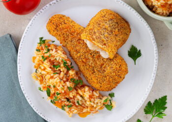 Filetes de pescada com arroz de tomate