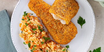 Filetes de pescada com arroz de tomate